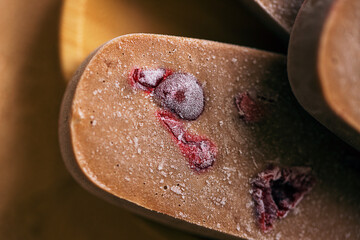 Homemade chocolate ice cream popsicle with cherries