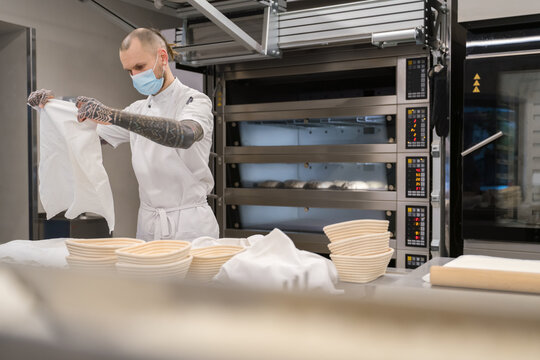 Baker Going To Wrap Dough

