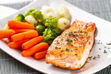 Salmon Fillet with Mixed Steamed Vegetables. High quality photo.