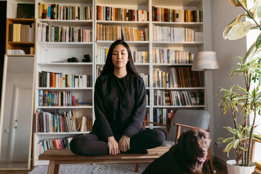 female east asian woman practicing mindfulness at home