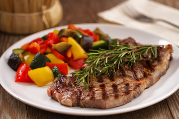 Grilled beefsteak with mushrooms and mixed vegetables.