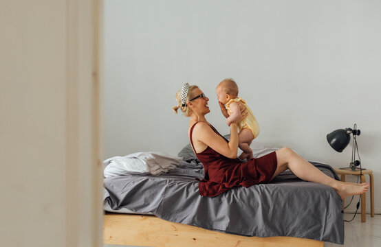 Motherhood: Caring Mother Having Some Wonderful Time With Her Baby