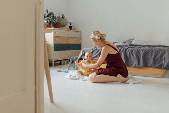 Motherhood: Baby Is Having Great Time Playing On The Floor