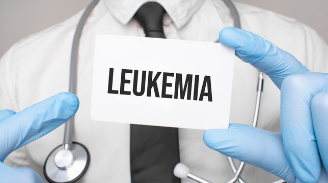 Doctor holding a card with leukemia, Medical concept