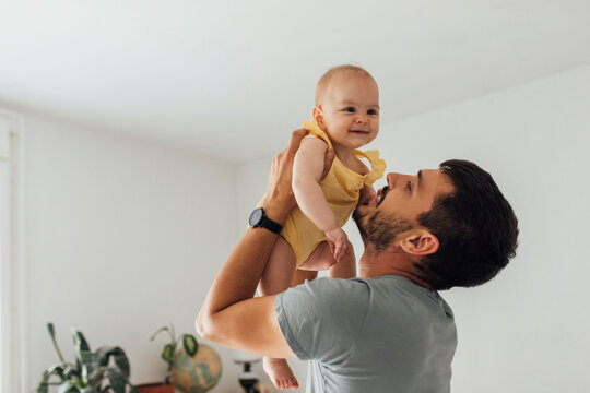 Happy Father Playing Some Games With His Kid Carefully