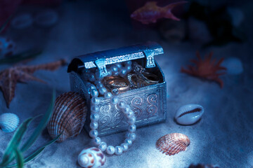 Fantasy on the theme of treasures lying on the bottom of the sea or ocean. Jewelry lying in a chest...