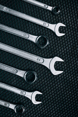 Set of chrome wrenches on steel surface. Mechanic tools for maintenance. Hardware tools to fix