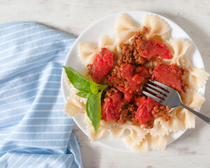 Delicious farfalle with bolognese sauce. An Italian hot dish.