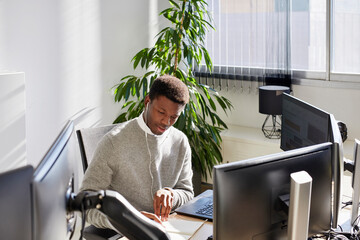 Black businessman writing 