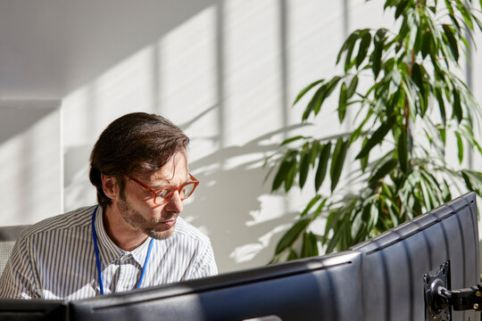Businessman working on computers