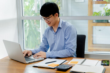Close up of businessperson using laptop working with digital data..
