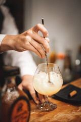Fototapeta na wymiar bartender pouring cocktail