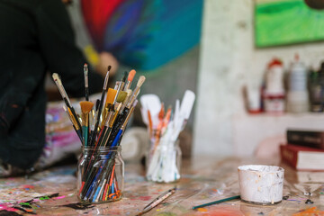 Close-up of brushes and art supplies