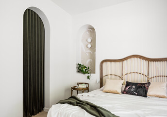 Cane bed and arched doorway