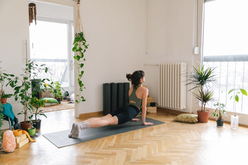 Young woman practice yoga at home 