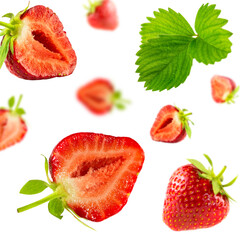 Background from strawberry halves and green leaves.