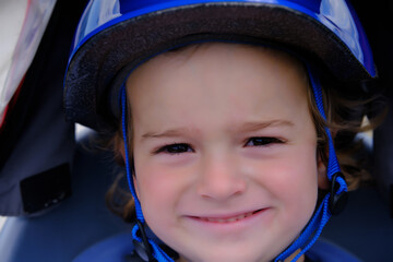 Close up of little boy with bike helmet