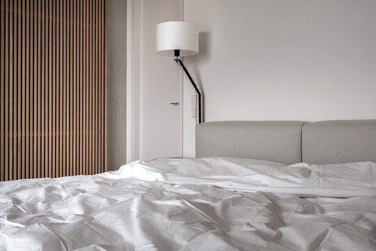 Interior of modern bedroom with light walls