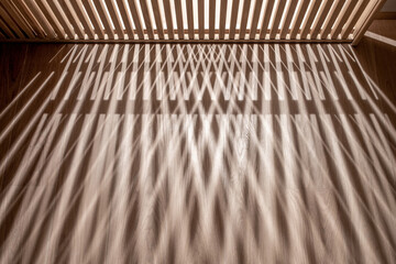 Backlighted latticed wooden door drops shadow on floor