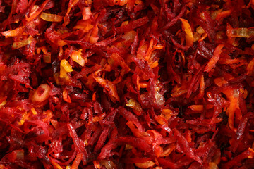 Fototapeta premium Color photograph of sliced beets, carrots and onions. Healthy vegetables with vitamins. Vegetarianism and veganism.