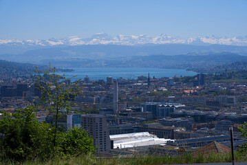 Panorama view over the City of Zurich with lake Zurich and Swiss alps in the background at a beautiful summer day. Photo taken June 14th, 2021, Zurich, Switzerland.