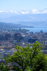 Panorama view over the City of Zurich with lake Zurich and Swiss alps in the background at a beautiful summer day. Photo taken June 14th, 2021, Zurich, Switzerland.