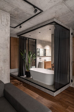 Illuminated interior in loft style with concrete elements