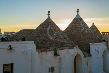 Fototapeta na wymiar Sunrise in Alberobello. the town of trulli in Puglia, a fantastic landscape