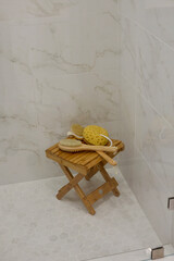 Luxury spa setting in master bath with stool, scrub brush and sponge