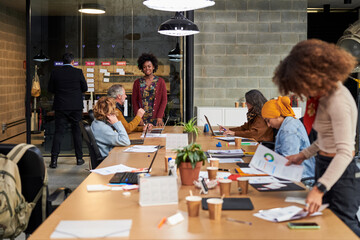 Colleagues preparing for meeting in office