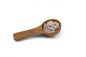 A heap of Whey chocolate protein powder  in a wooden spoon isolated on white background.