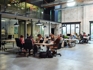 People working in open space office