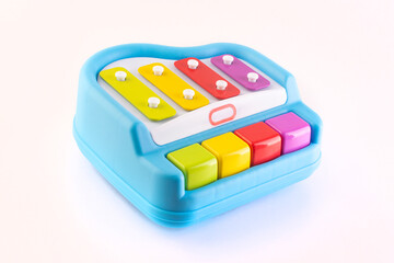 children's toy - piano with four keys on a white background