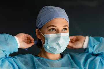 Medical Worker Prepares Her Personal Protective Equipment 