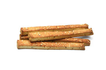 Homemade cheese sticks with cumin and sesame seeds. Bread sticks isolated on whute background. Baked salty sticks with salt and cumin. Golden baked savory pastry. Home baking appetizers. 