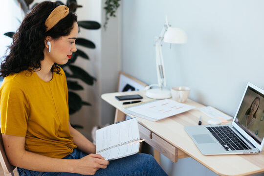 Young woman studying online at home