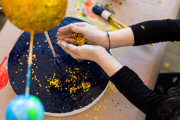 Little hands with gold stars glitter