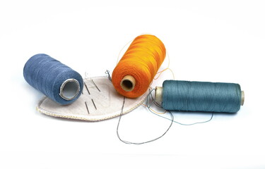 Color sewing threads isolated on white background.