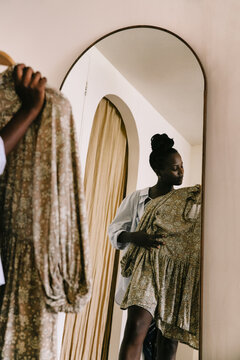 Black Woman Shopping for Dress in Boutique