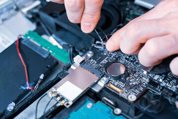 Fototapeta na wymiar Technology repair of pc electronic equipment. Computer service. Technician engineer man do maintenance of hardware.