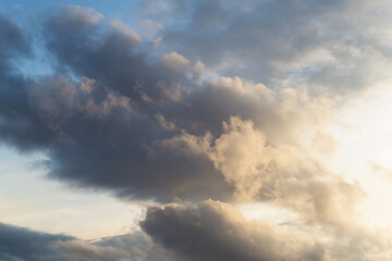 Fototapeta na wymiar Beautiful clouds in the sky. Evening warm light through the clouds.