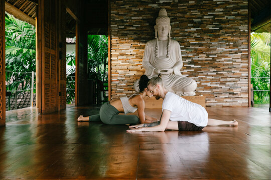Student and Teacher Practicing Alignment Yoga Together