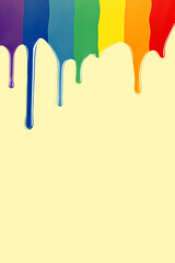 Drops of paint falling as LGBT flag in a yellow background. paint rainbow. vertical image with copy space.