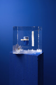 Big ice cube with frozen objects inside