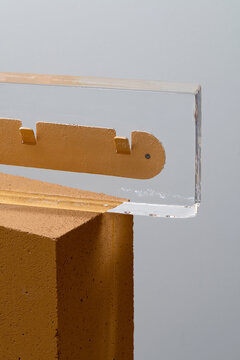 Big ice brick with frozen colorful hanger inside