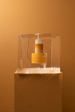 Big ice cube with frozen colorful lamp inside