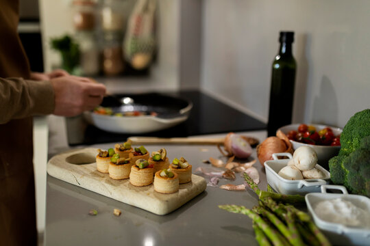 man preparing fancy appetizers