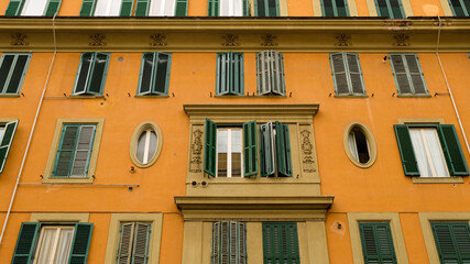 Rome, Testaccio neighborhood. Building facade with two unusual ovals at both sides of the central...