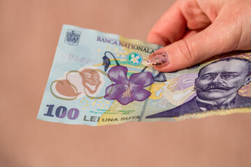 Selective focus on detail of LEI banknotes. Counting or giving Romanian LEI banknotes. World money concept, inflation and economy concept