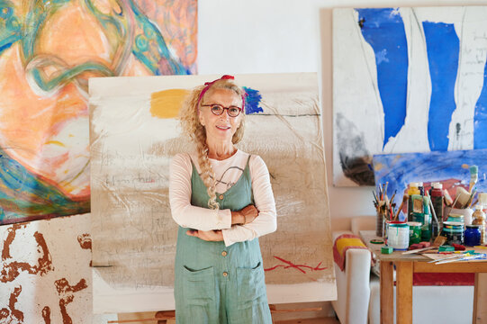 Smiling senior woman in her art studio